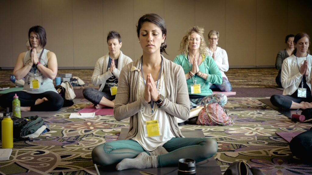 a group of people doing meditation