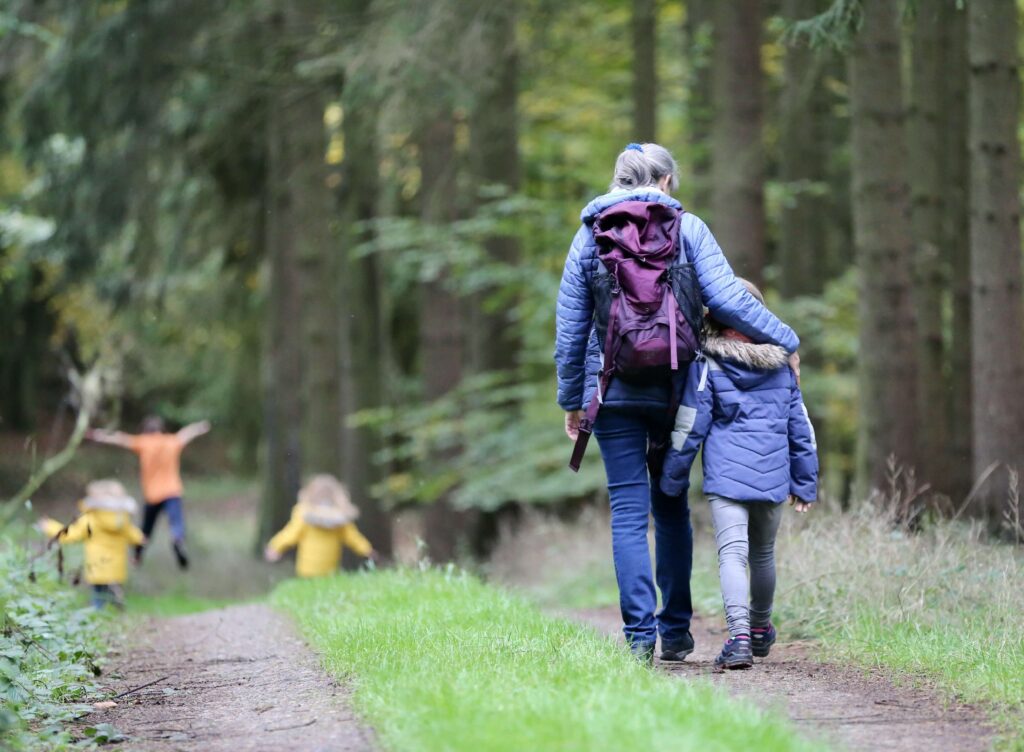 A woman went for a walk in nature with her children to relieve stress