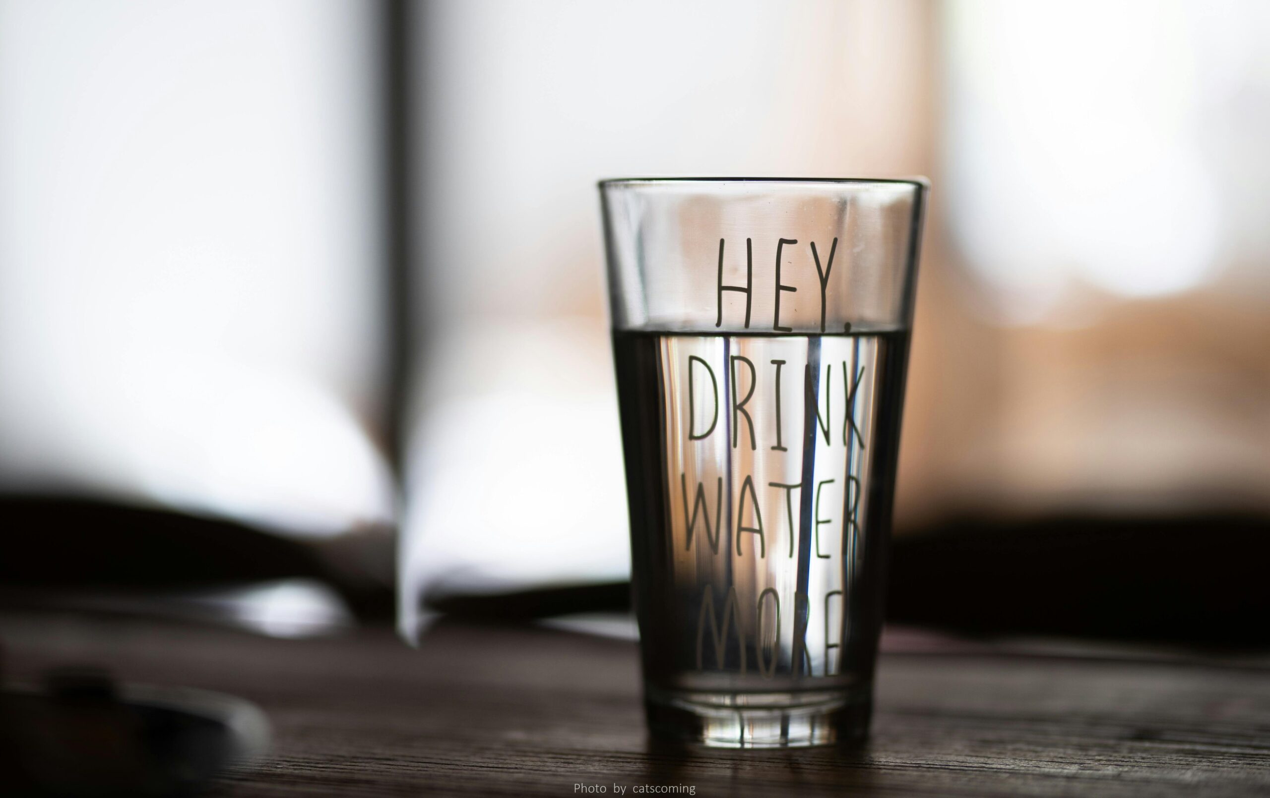 a glass of water with motivational words