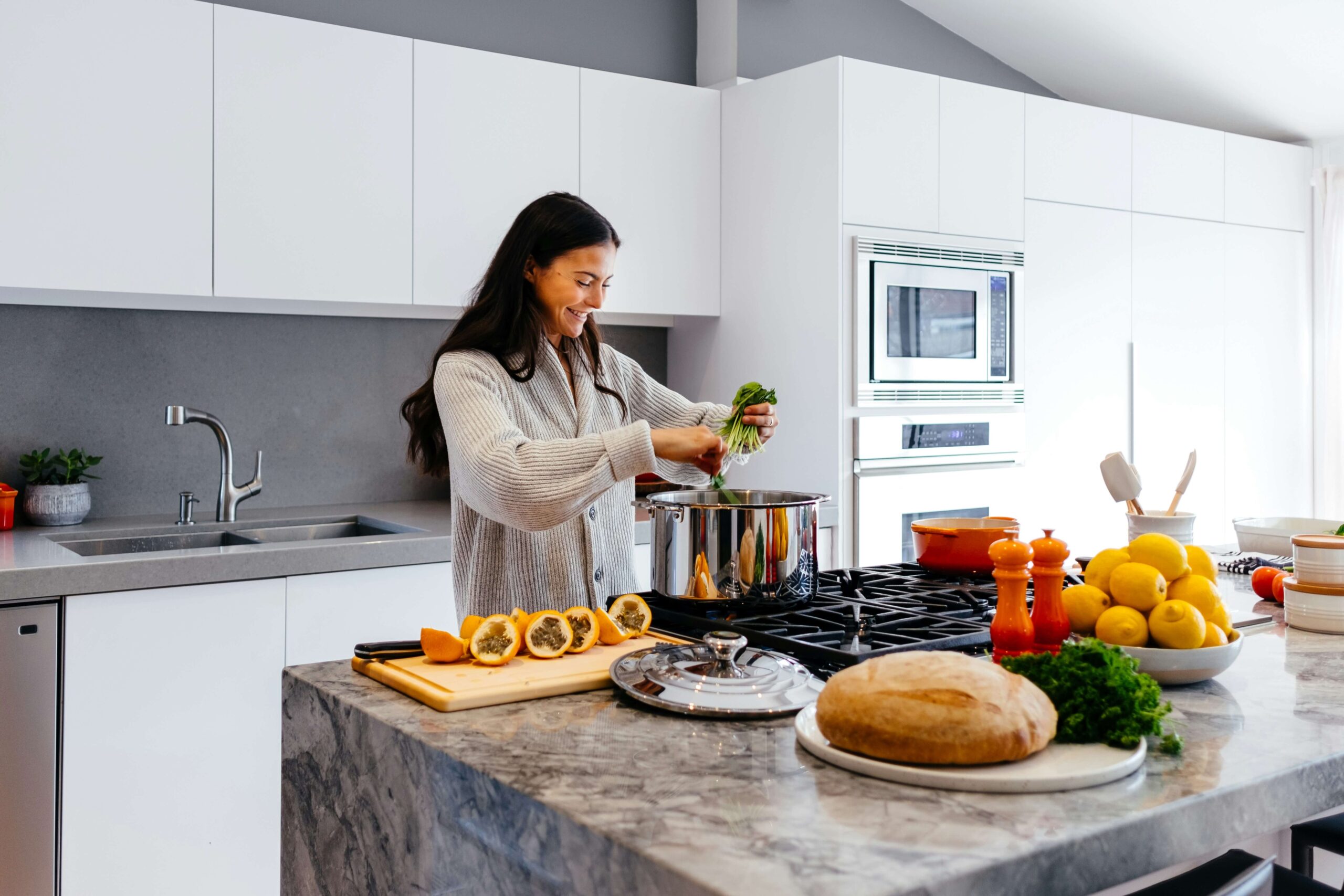 7 Easy Ways to Maintain a Healthy Lifestyle 1 a woman preparing a fresh, healthy meal with ingredients like vegetables and herbs