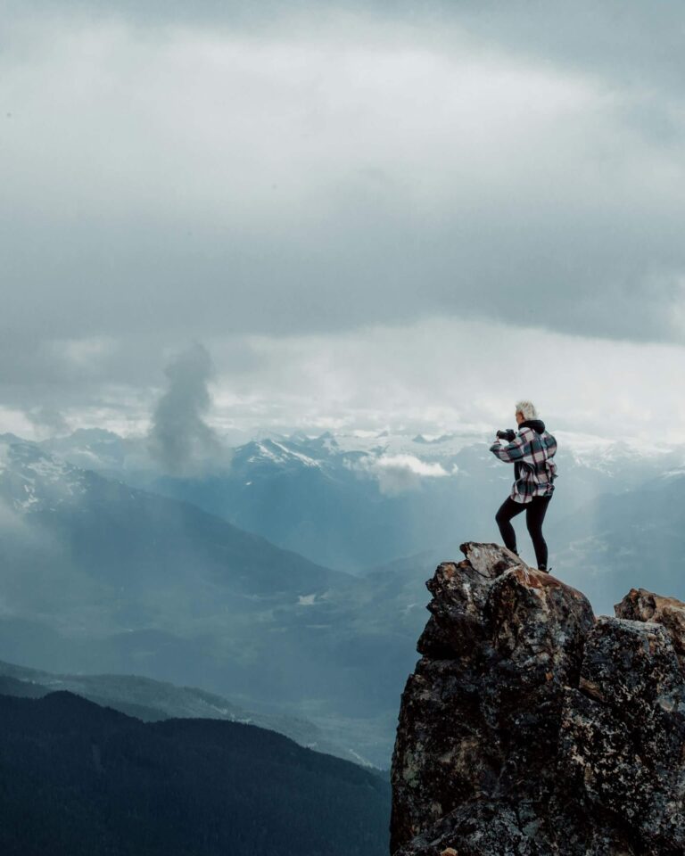 A person at the top of the mountain